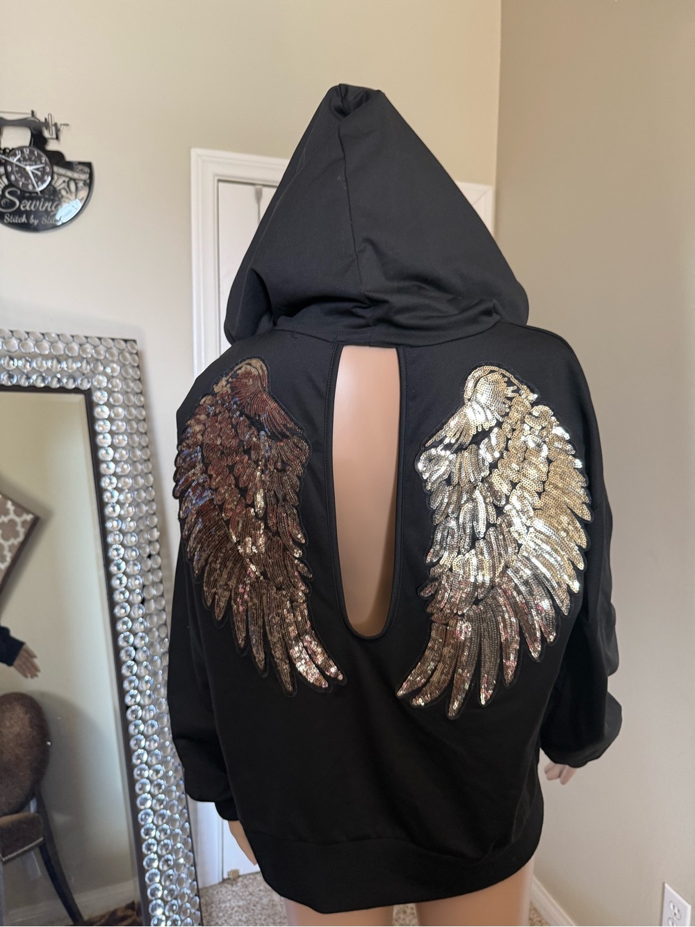 chic Black Hoodie with Gold Sequin Wing Appliqués